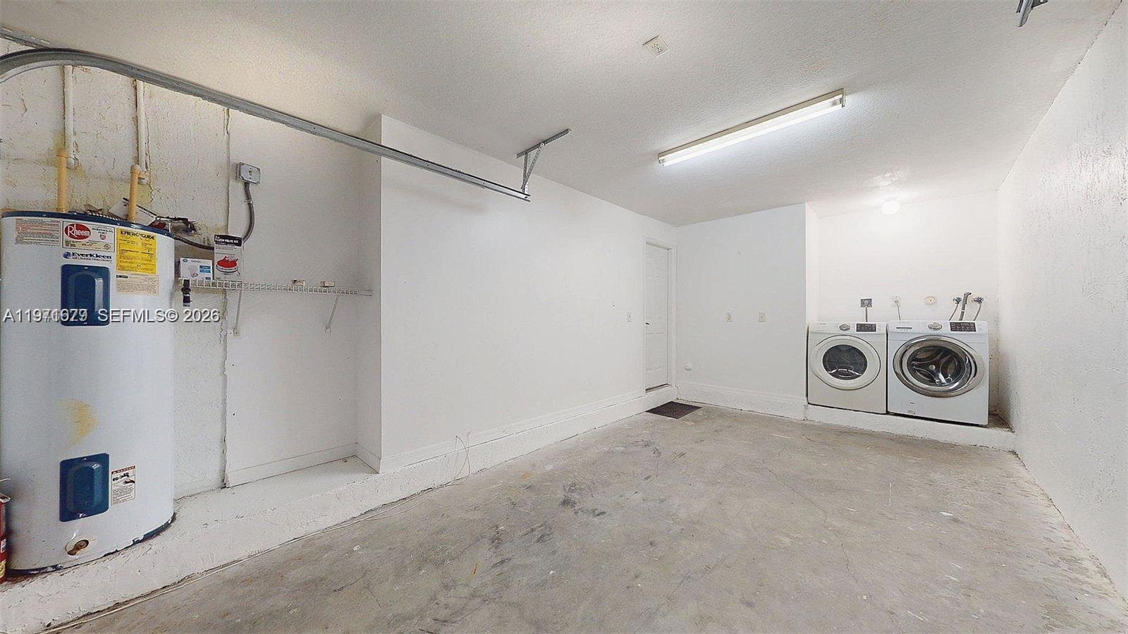 14162 Southwest 260th Street, Unit 104 Homestead, FL 33032 - Photo 33 of 35 a utility room with dryer and washer