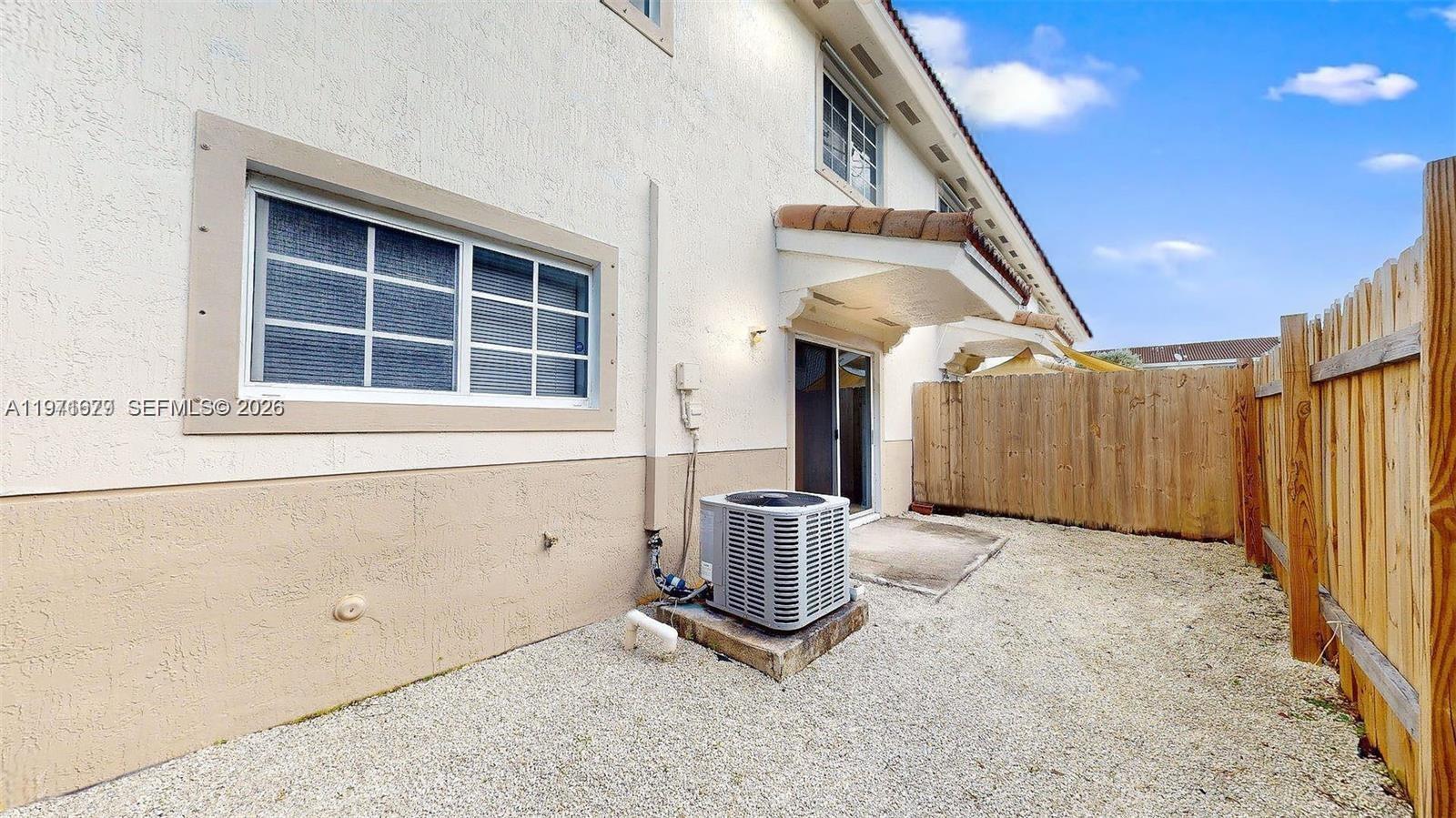 14162 Southwest 260th Street, Unit 104 Homestead, FL 33032 - Photo 34 of 35 a view of an entryway with staircase
