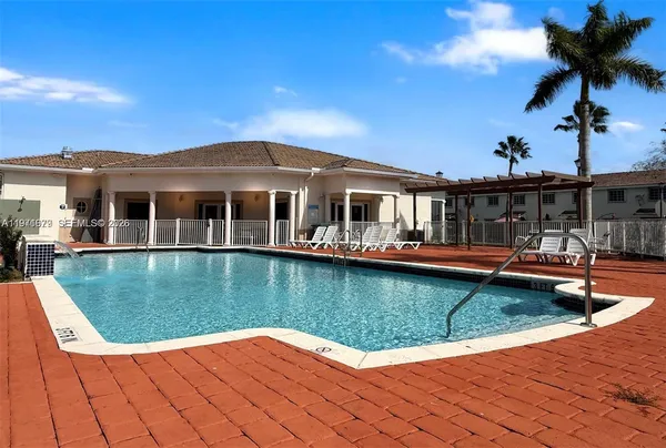 a view of a house with swimming pool