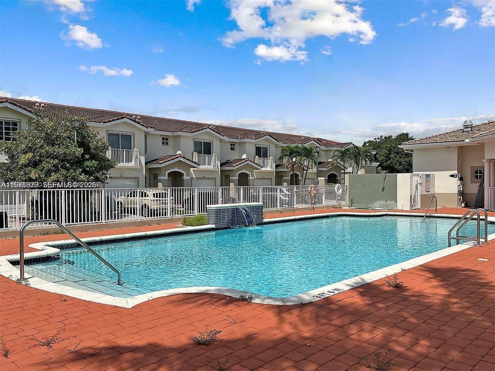 14162 Southwest 260th Street, Unit 104 Homestead, FL 33032 - Photo 5 of 35 a view of a house with a big yard