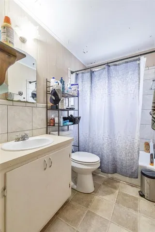 a bathroom with a bathtub and window