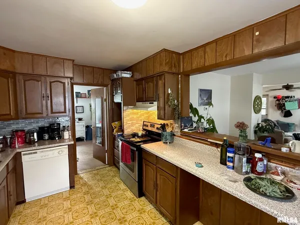 a kitchen with lots of counter top space and a sink