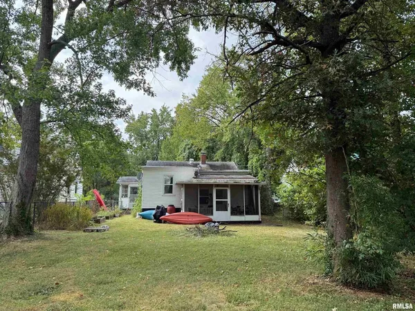 a front view of house with yard and seating area