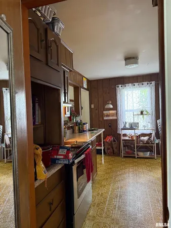 a kitchen that has a lot of cabinets in it