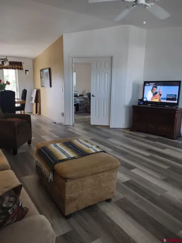 a view of a tree in front of a white house