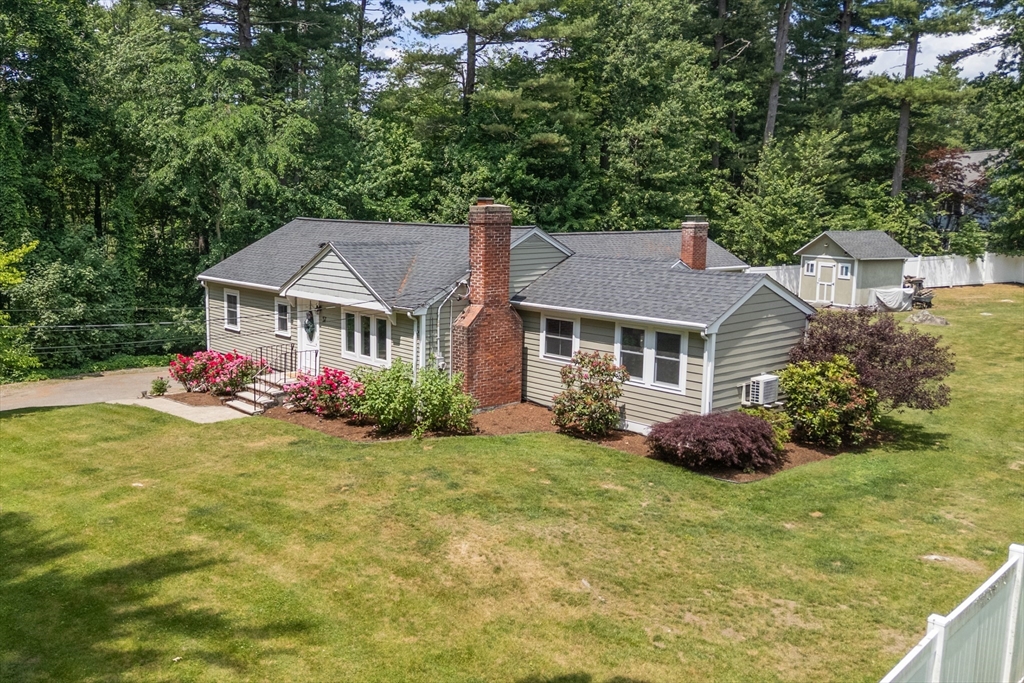 57 Marlboro Road Sudbury, MA 01776 - Photo 36 of 40 a front view of a house with garden