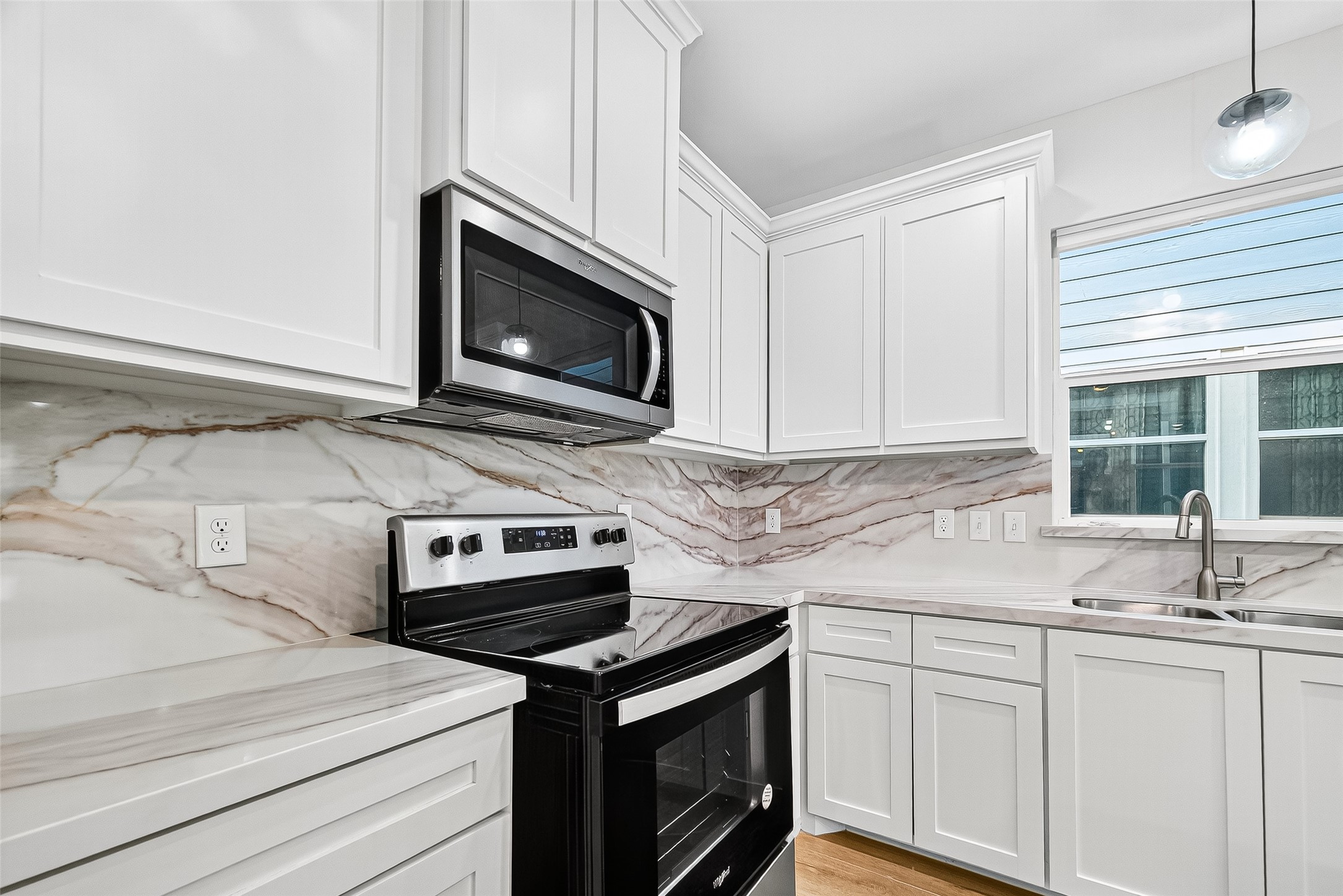 716 Zoe Street Houston, TX 77020 - Photo 11 of 39 a kitchen with granite countertop cabinets stainless steel appliances and a sink