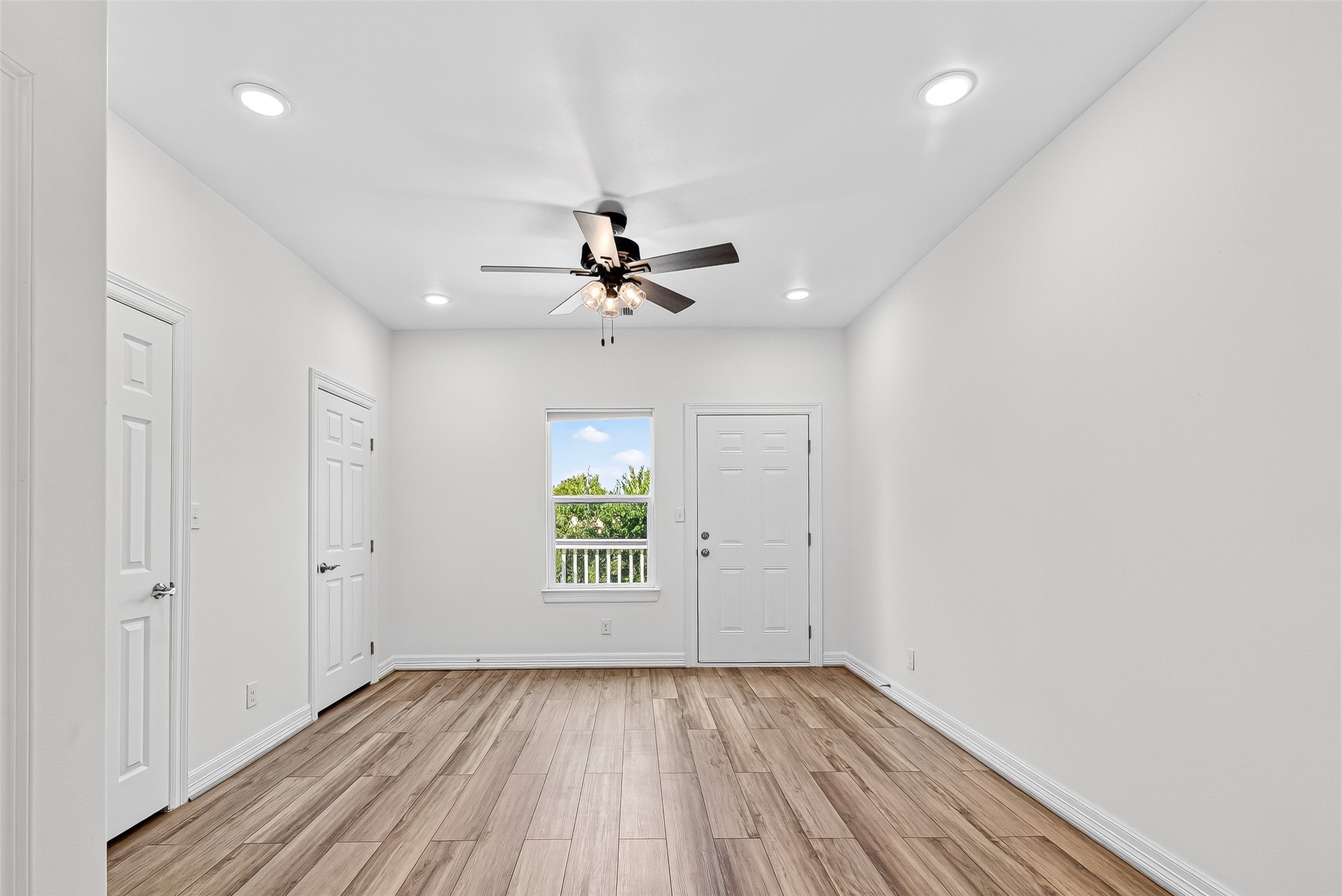 716 Zoe Street Houston, TX 77020 - Photo 19 of 39 wooden floor in an empty room with a window
