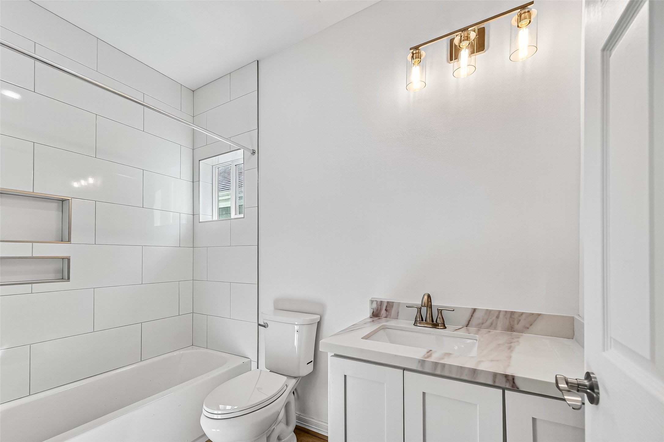 716 Zoe Street Houston, TX 77020 - Photo 27 of 39 a bathroom with a granite countertop sink toilet and shower