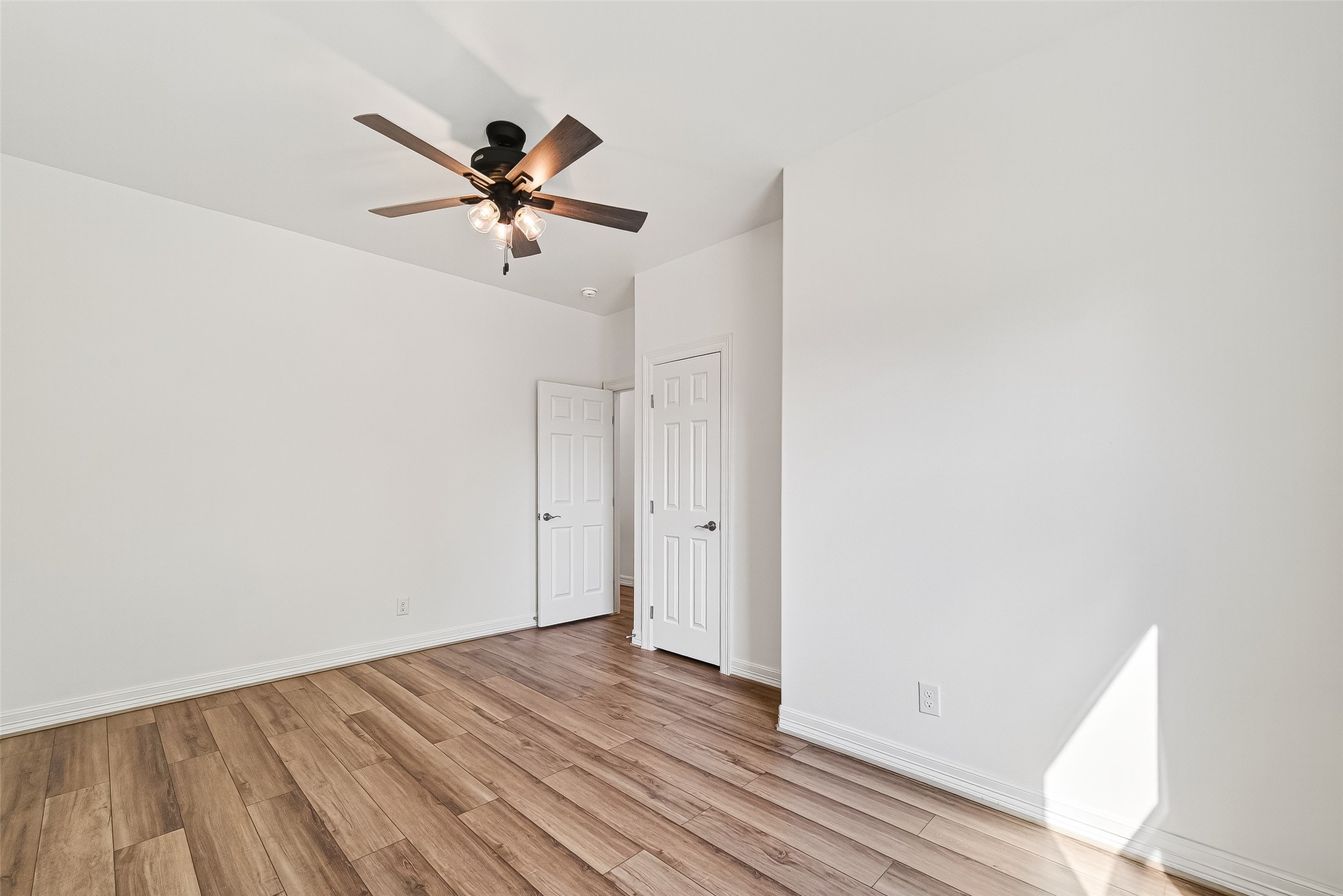 716 Zoe Street Houston, TX 77020 - Photo 31 of 39 a view of a room with wooden floor ceiling fan