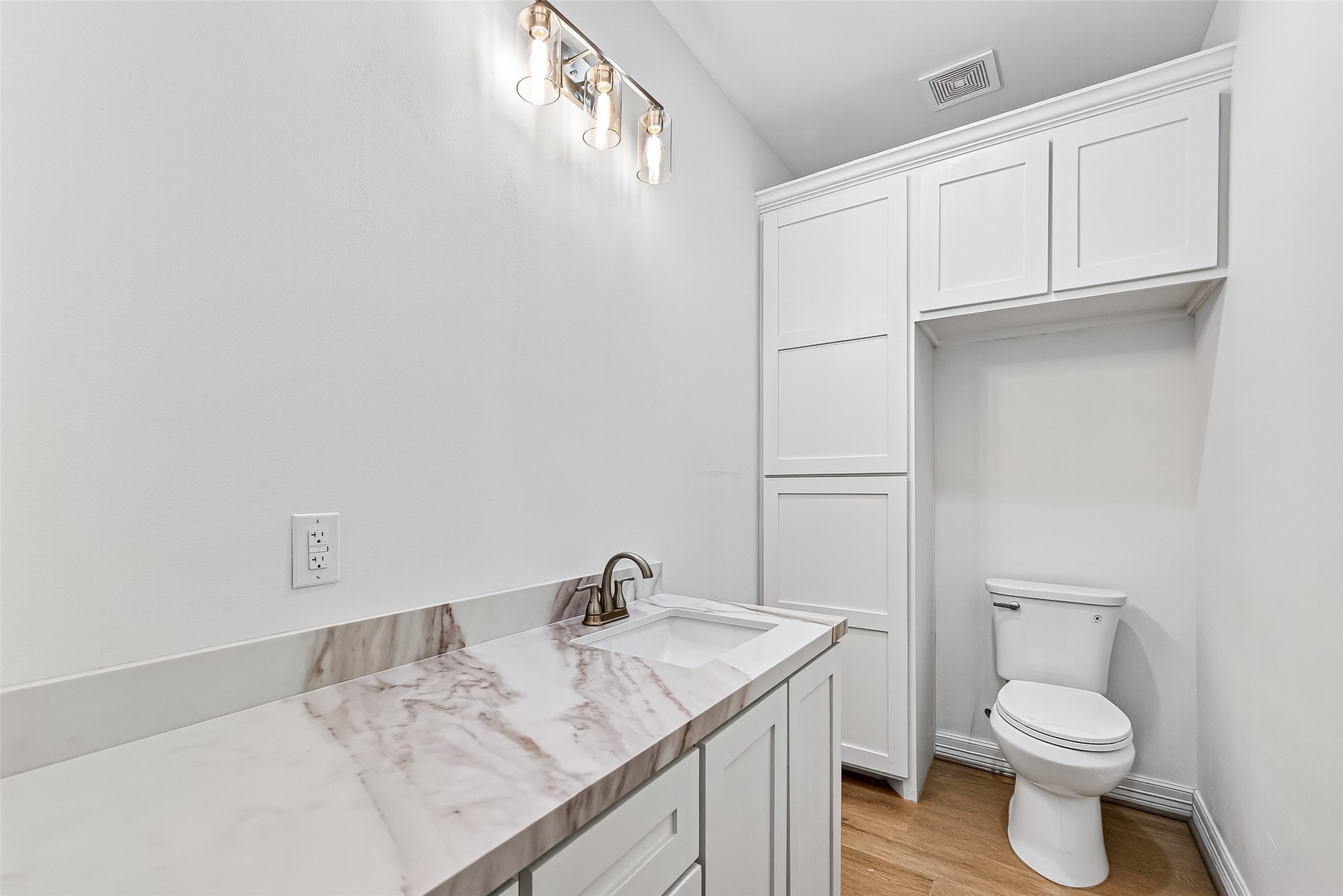 716 Zoe Street Houston, TX 77020 - Photo 6 of 39 a bathroom with a granite countertop sink vanity mirror and toilet