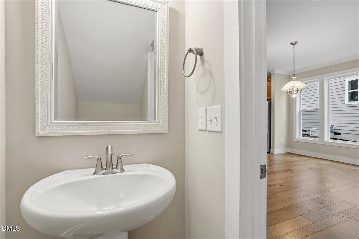 4409 Spiedie Court Raleigh, NC 27606 - Photo 14 of 33 a bathroom with a sink and a mirror