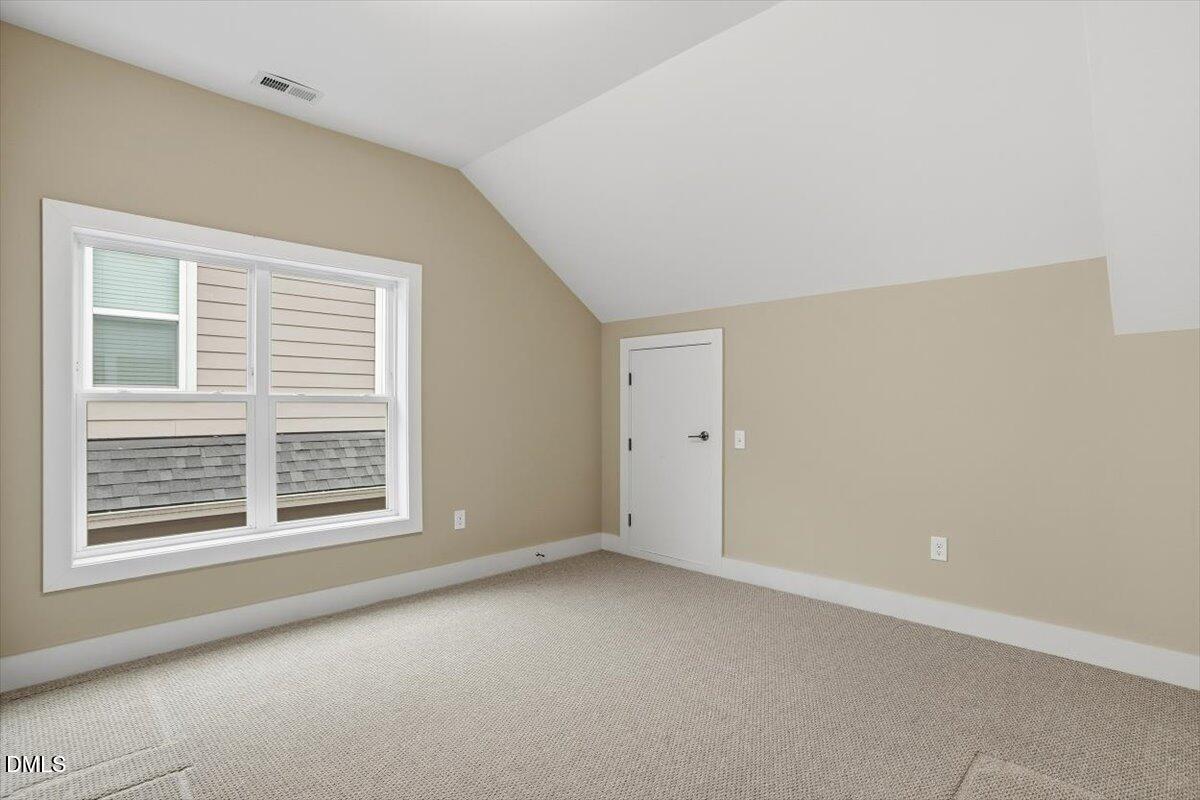 4409 Spiedie Court Raleigh, NC 27606 - Photo 22 of 33 a view of an empty room with a window