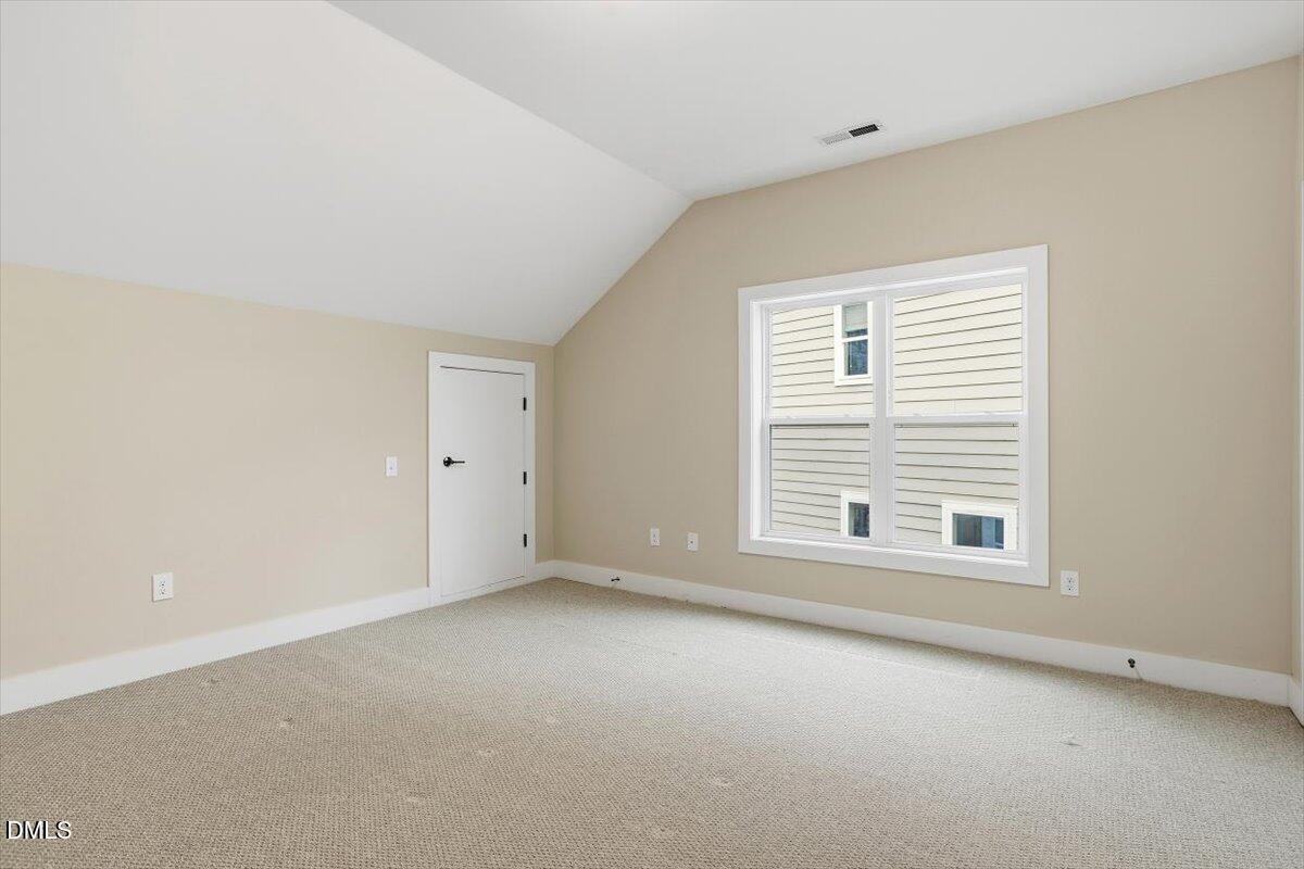 4409 Spiedie Court Raleigh, NC 27606 - Photo 23 of 33 a view of an empty room with a window