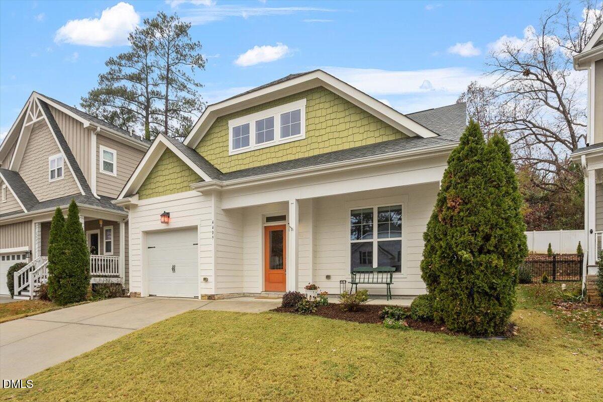 4409 Spiedie Court Raleigh, NC 27606 - Photo 25 of 33 a front view of a house with garden