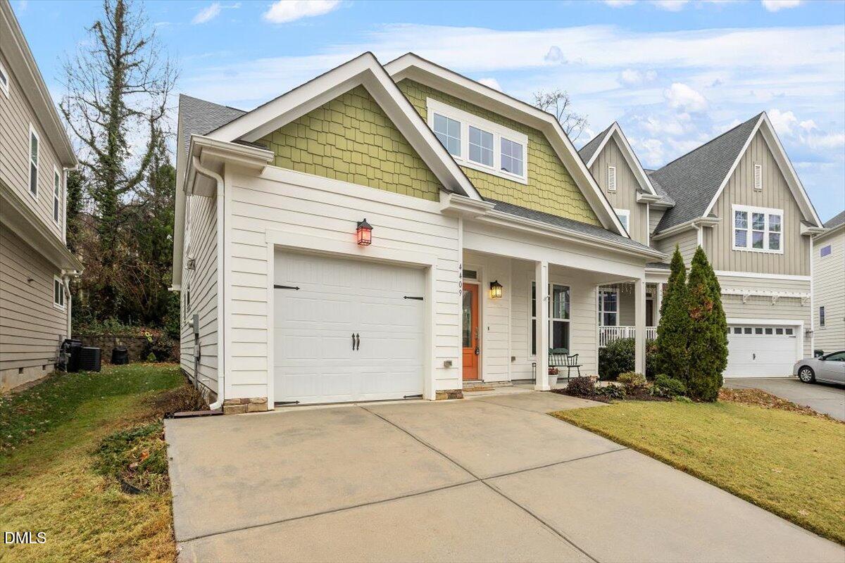 4409 Spiedie Court Raleigh, NC 27606 - Photo 26 of 33 a front view of a house with a yard