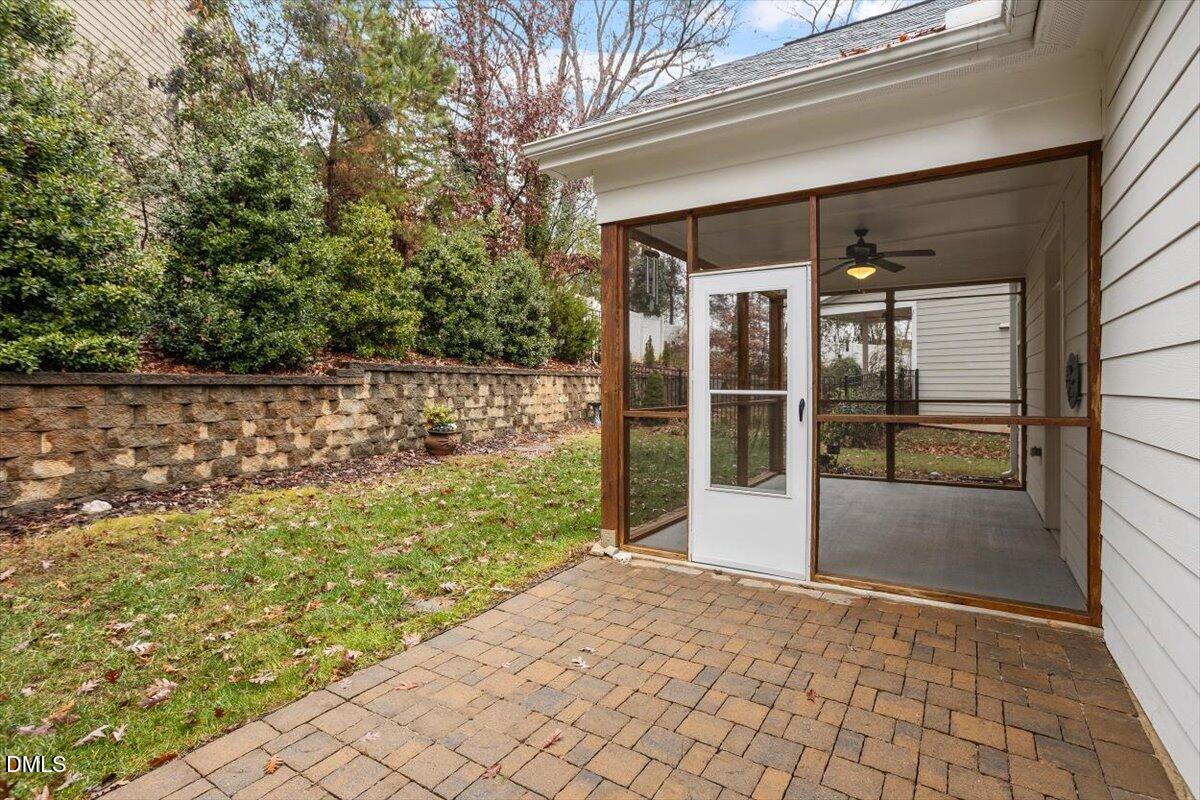 4409 Spiedie Court Raleigh, NC 27606 - Photo 30 of 33 a view of a glass door with a yard