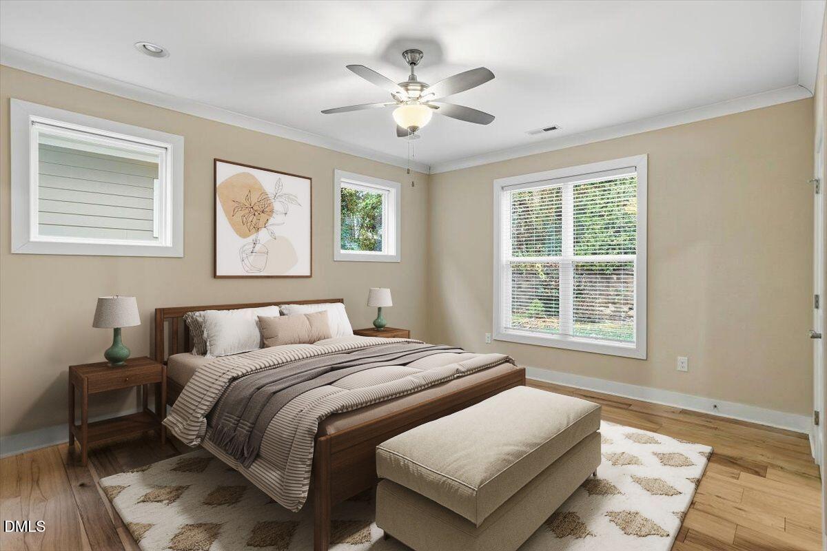 4409 Spiedie Court Raleigh, NC 27606 - Photo 5 of 33 a bedroom with a large bed and a window