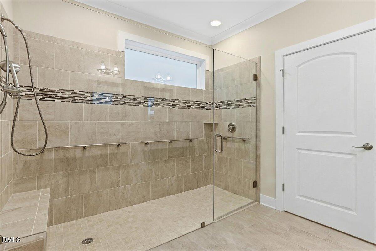 4409 Spiedie Court Raleigh, NC 27606 - Photo 6 of 33 a bathroom with a shower