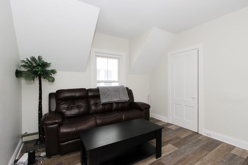 2 High Street Middleboro, MA 02346 - Photo 32 of 41 a living room with furniture and a potted plant