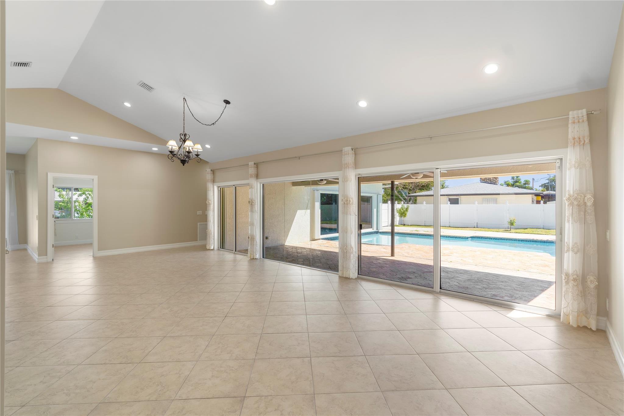 698 Northwest 12th Road Boca Raton, FL 33486 - Photo 4 of 20 Pool view living room with large windows