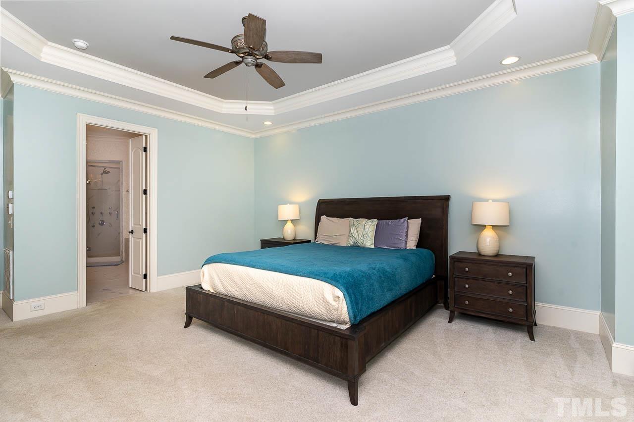 11308 Moonsprite Way Raleigh, NC 27614 - Photo 29 of 53 a bedroom with a bed and ceiling fan