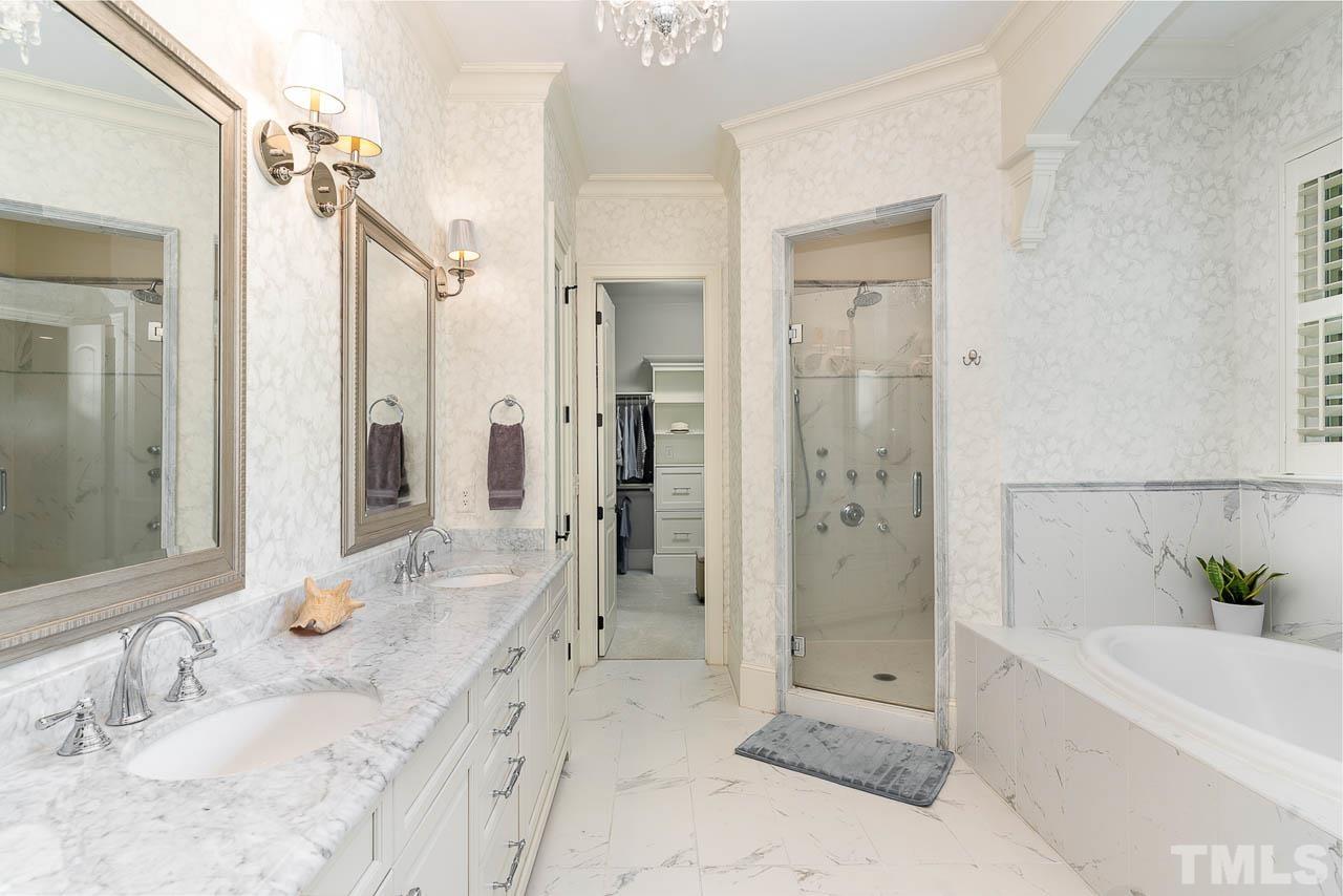 11308 Moonsprite Way Raleigh, NC 27614 - Photo 30 of 53 a bathroom with a granite countertop tub sink shower and a mirror