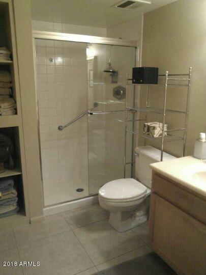 7820 East Camelback Road, Unit 310 Scottsdale, AZ 85251 - Photo 13 of 28 a bathroom with a toilet and a shower