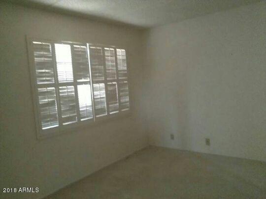 7820 East Camelback Road, Unit 310 Scottsdale, AZ 85251 - Photo 14 of 28 a view of empty room with windows