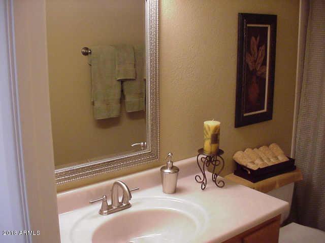 7820 East Camelback Road, Unit 310 Scottsdale, AZ 85251 - Photo 16 of 28 a bathroom with a sink and a mirror