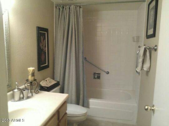 7820 East Camelback Road, Unit 310 Scottsdale, AZ 85251 - Photo 17 of 28 a bathroom with a sink a toilet and shower