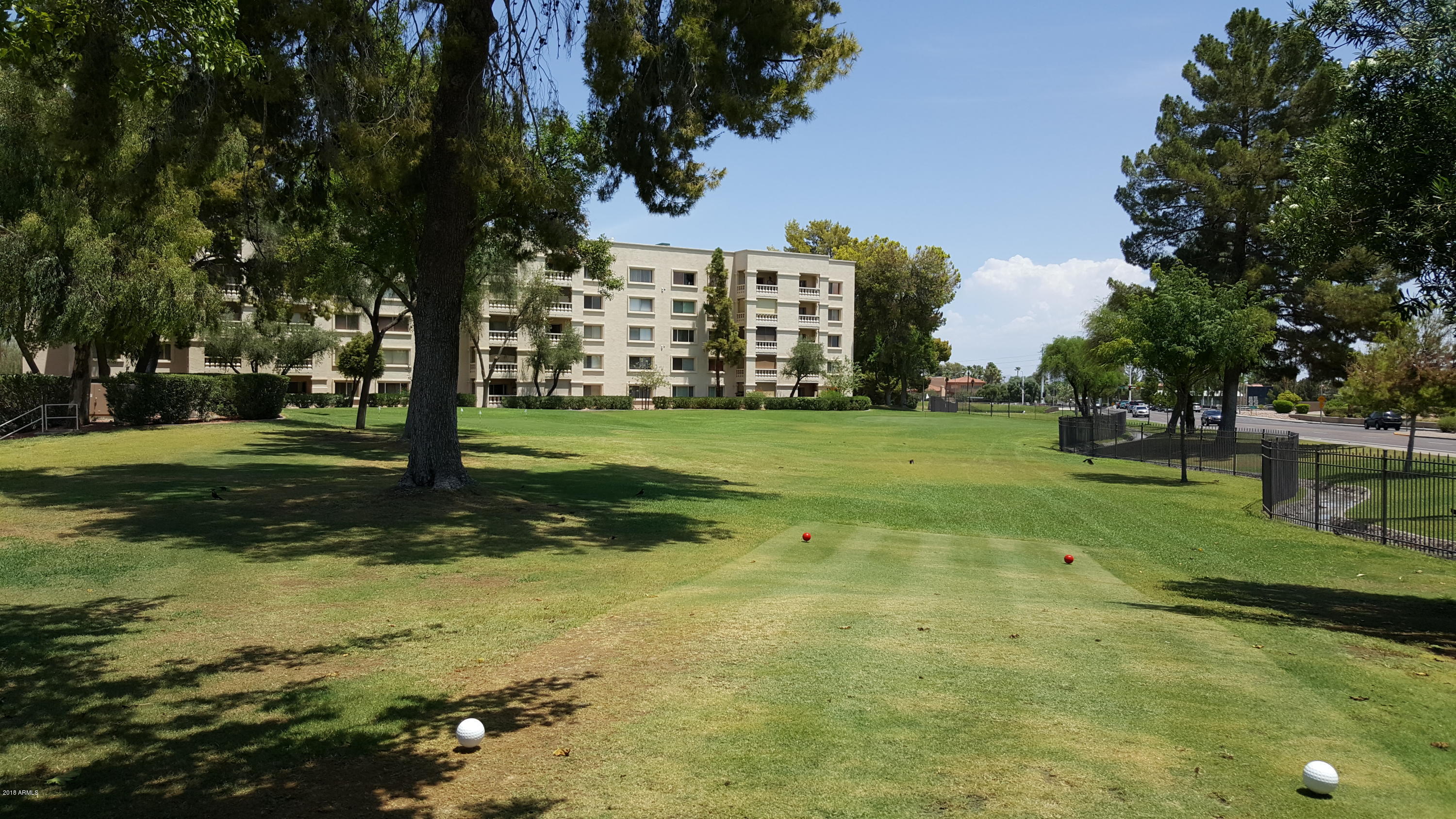 7820 East Camelback Road, Unit 310 Scottsdale, AZ 85251 - Photo 24 of 28 a view of a park with swings and slides