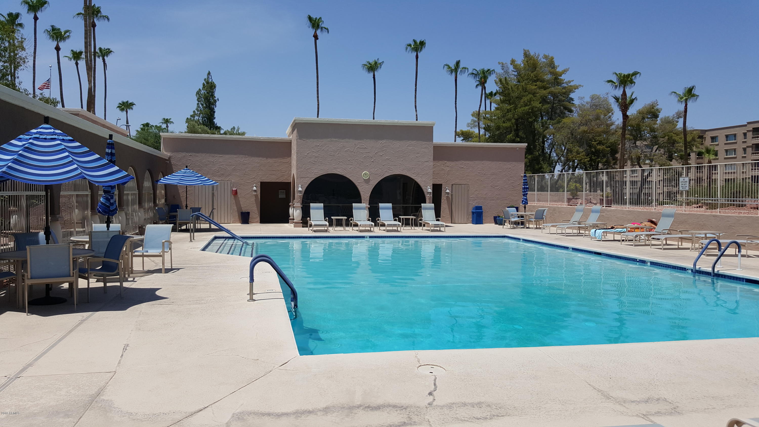 7820 East Camelback Road, Unit 310 Scottsdale, AZ 85251 - Photo 25 of 28 a view of a house with a swimming pool