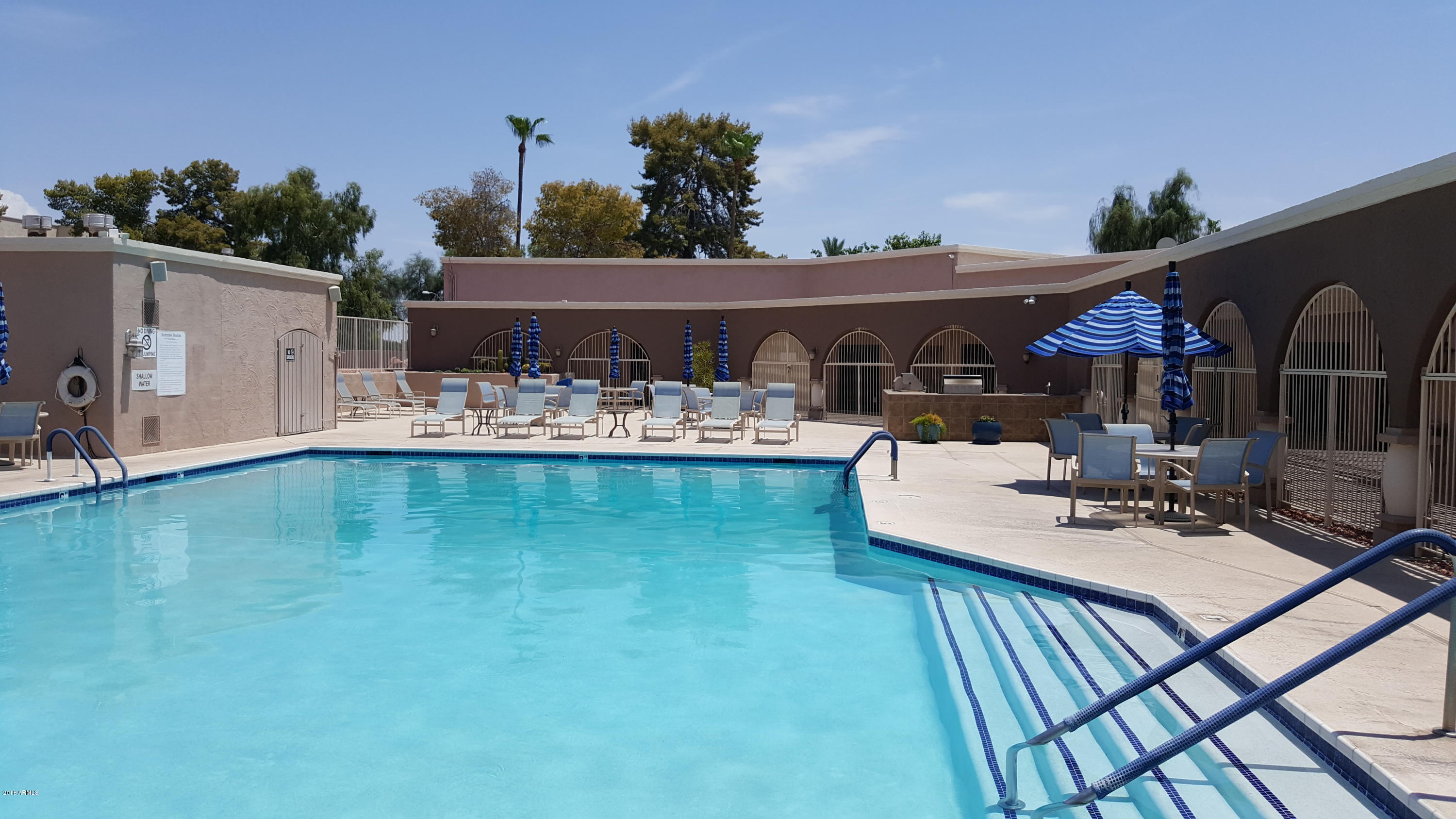 7820 East Camelback Road, Unit 310 Scottsdale, AZ 85251 - Photo 26 of 28 a view of a swimming pool with a patio