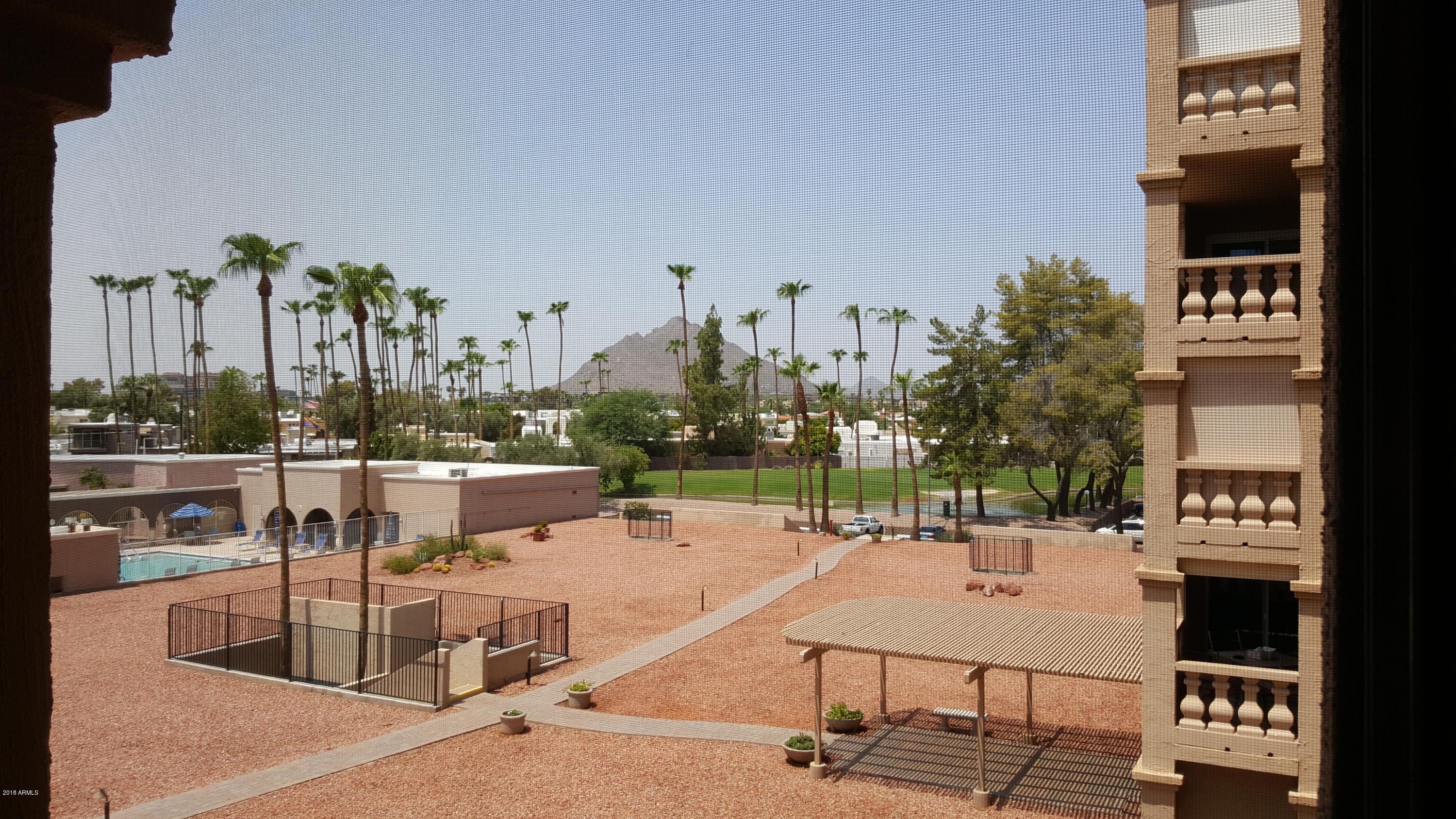 7820 East Camelback Road, Unit 310 Scottsdale, AZ 85251 - Photo 7 of 28 a view of a terrace with chairs