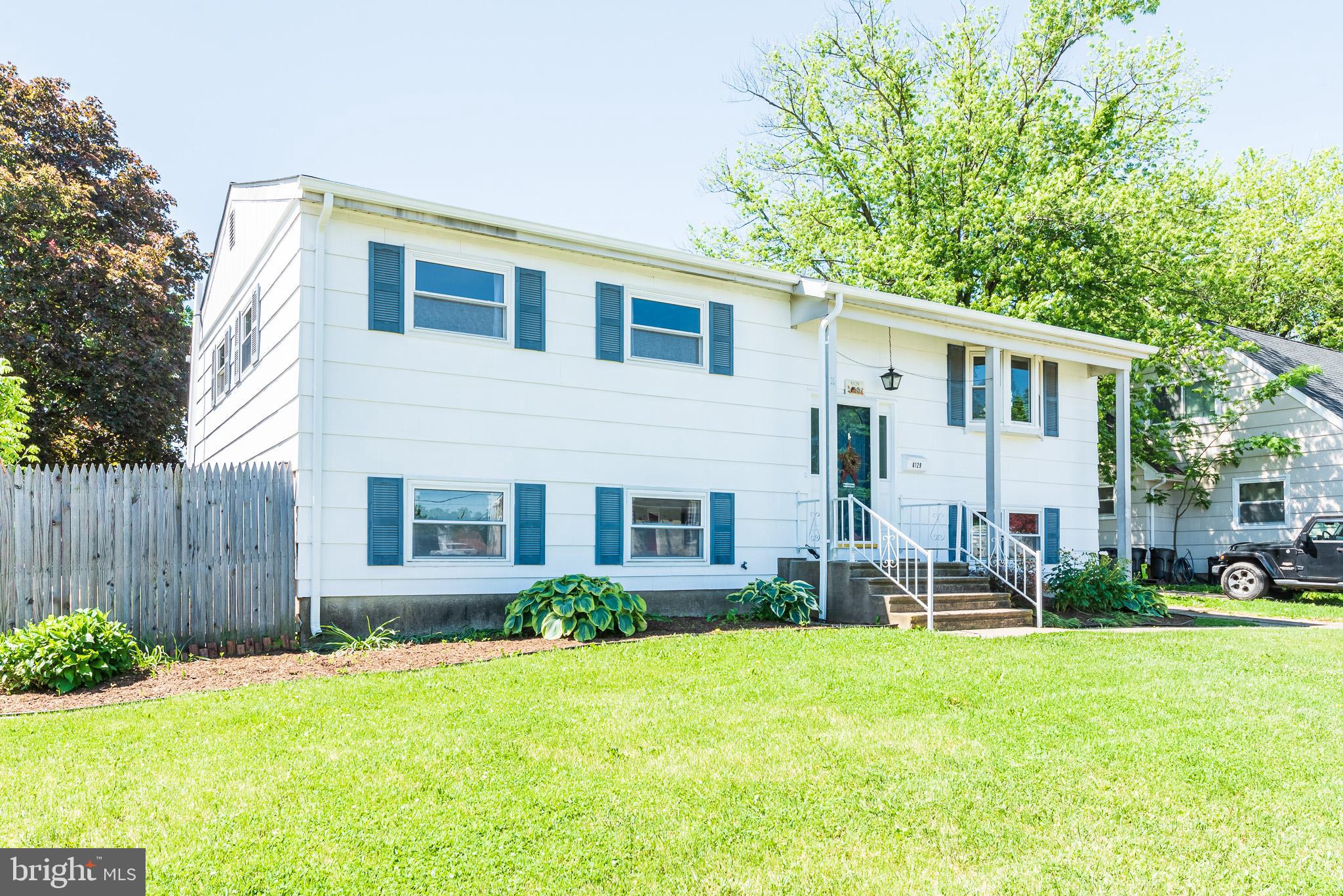 6129 Wheatland Road Baltimore, MD 21228 - Photo 1 of 48 a front view of house with yard and green space