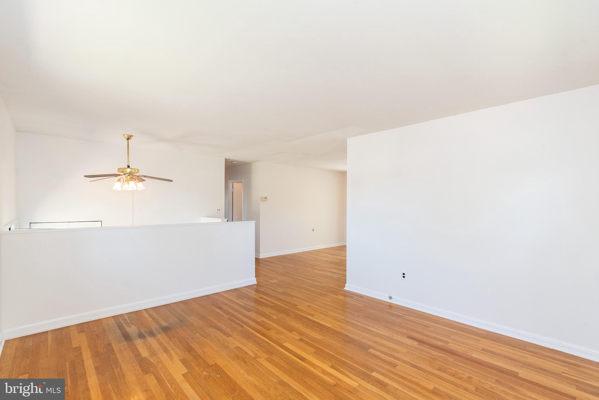 6129 Wheatland Road Baltimore, MD 21228 - Photo 11 of 48 a view of a room with wooden floor