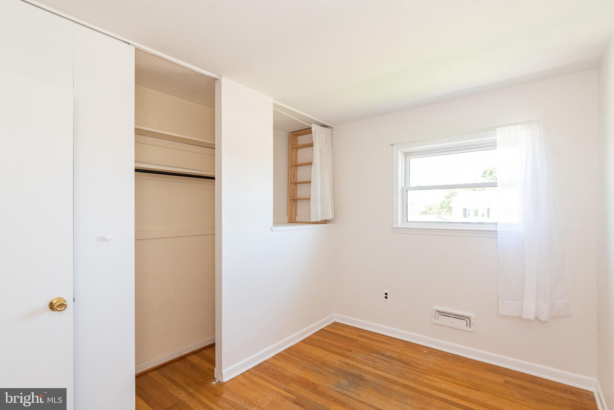 6129 Wheatland Road Baltimore, MD 21228 - Photo 19 of 48 a view of a room with wooden floor and small space