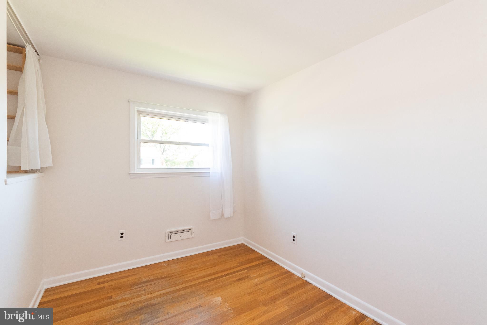 6129 Wheatland Road Baltimore, MD 21228 - Photo 22 of 48 a view of a room that has a window in it
