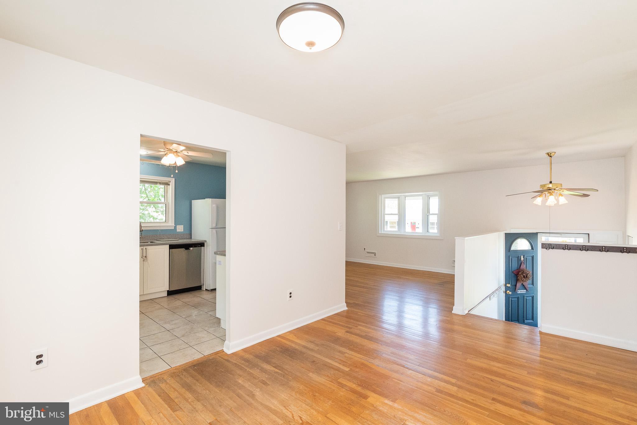 6129 Wheatland Road Baltimore, MD 21228 - Photo 28 of 48 a view of a room with wooden floor and a window