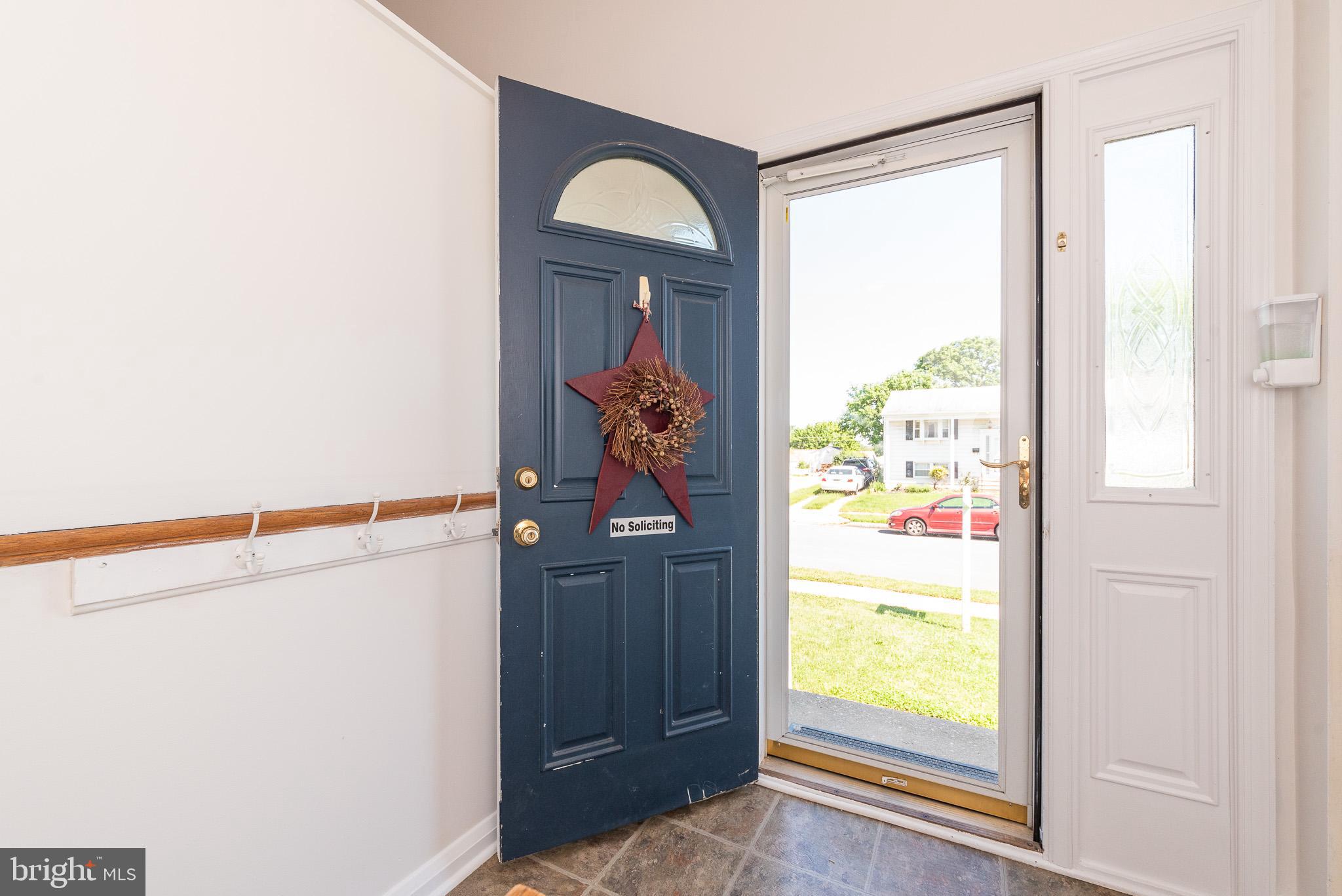 6129 Wheatland Road Baltimore, MD 21228 - Photo 4 of 48 a view of front door