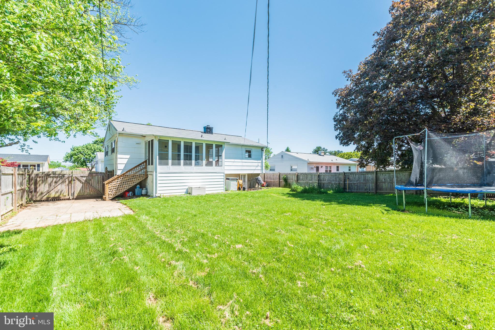 6129 Wheatland Road Baltimore, MD 21228 - Photo 45 of 48 a view of a house with backyard and a sitting area