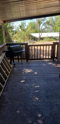 a room with a sink a window and a rug