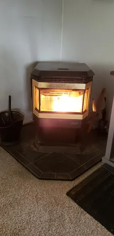 a view of a dry yard with wooden fence
