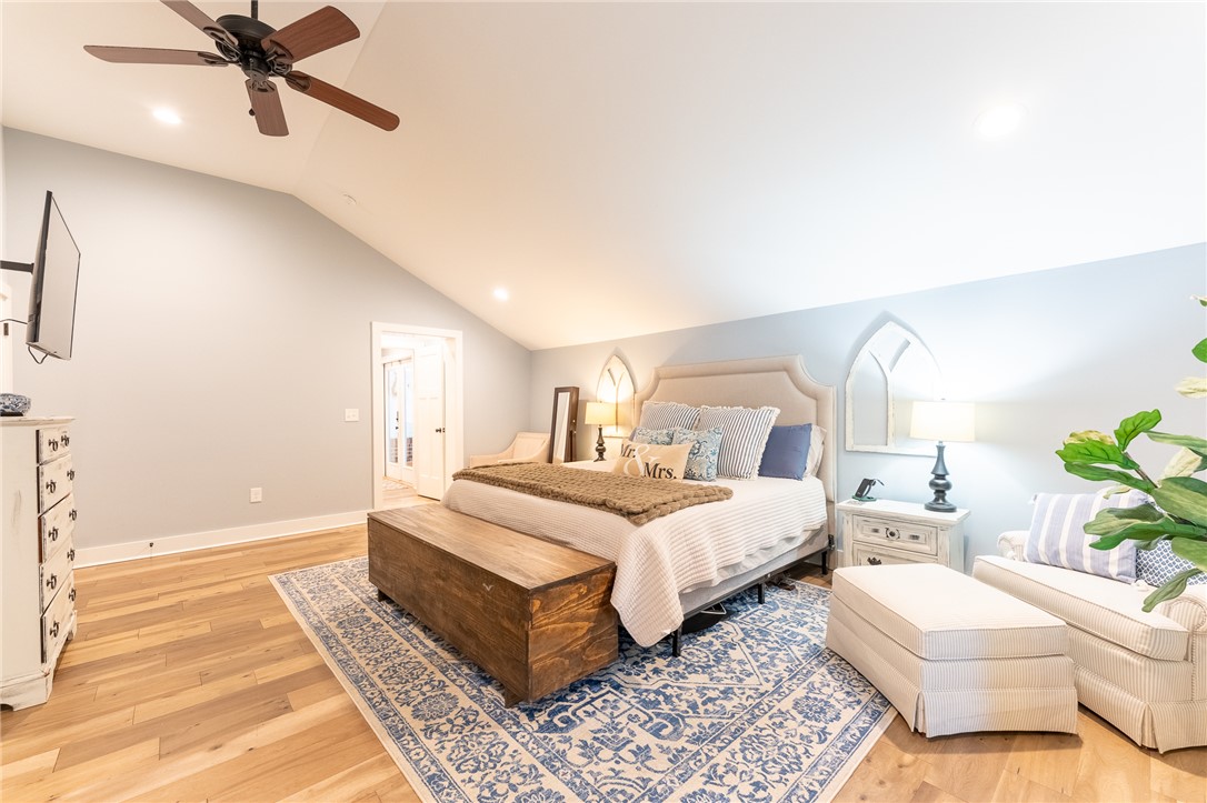 103 Riggs Drive Clemson, SC 29631 - Photo 15 of 50 Natural light illuminates this spacious bedroom with vaulted ceilings and gleaming hardwood floors.