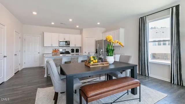 a view of kitchen with dining table and chairs