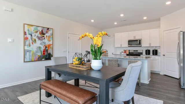 a kitchen with a table and chairs in it