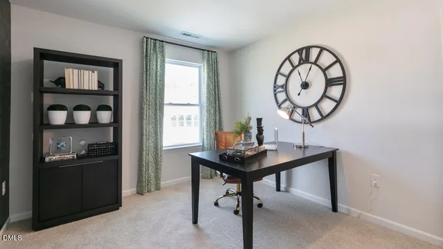 a view of a room with a table and chairs