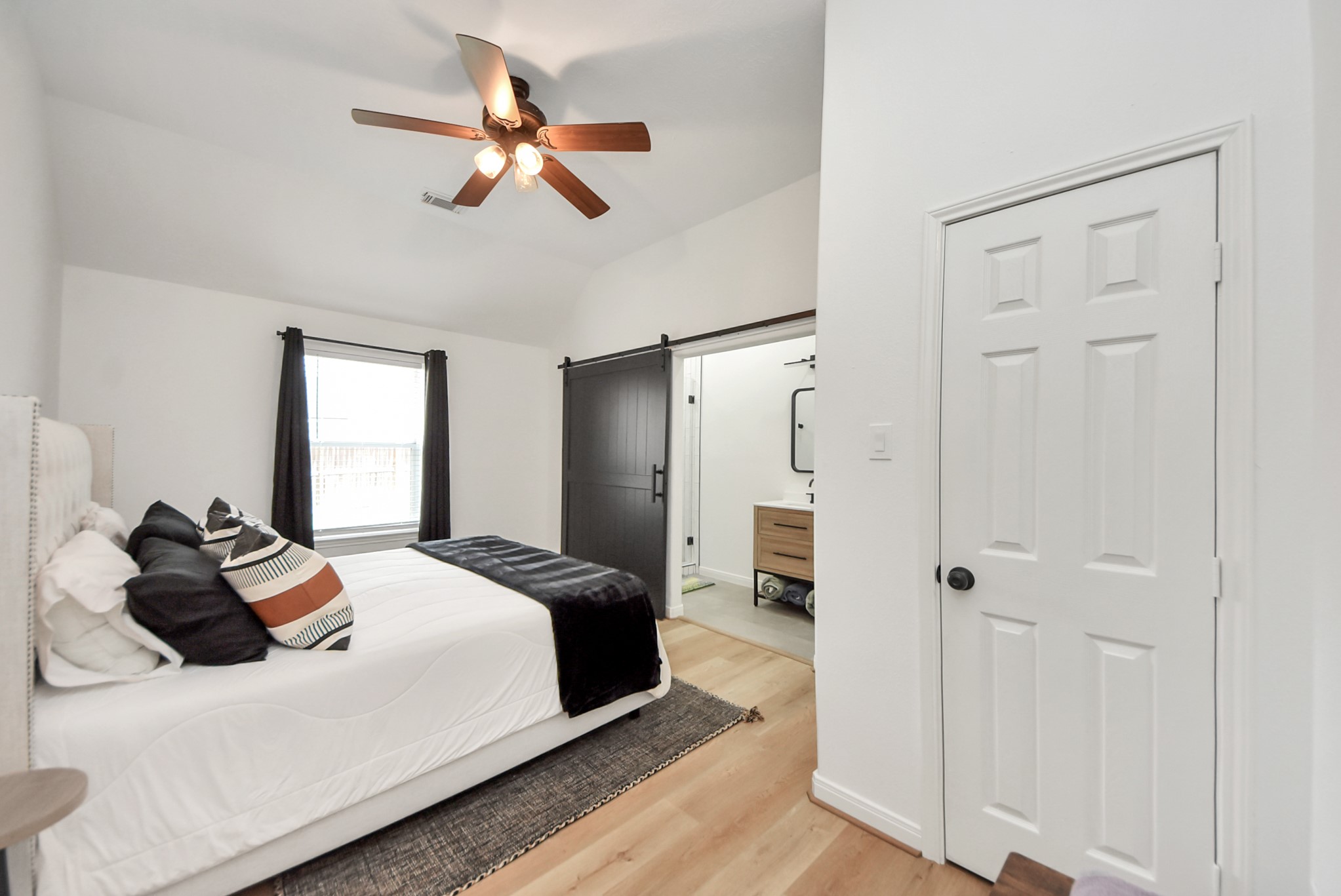 1910 Fox Path Court Katy, TX 77494 - Photo 12 of 29 a bedroom with a bed and a chandelier