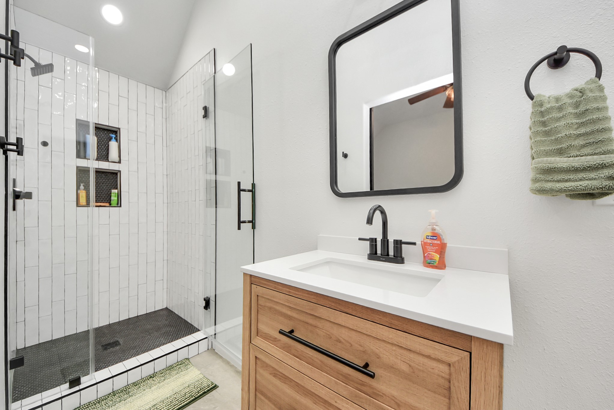 1910 Fox Path Court Katy, TX 77494 - Photo 13 of 29 a bathroom with a shower sink and mirror